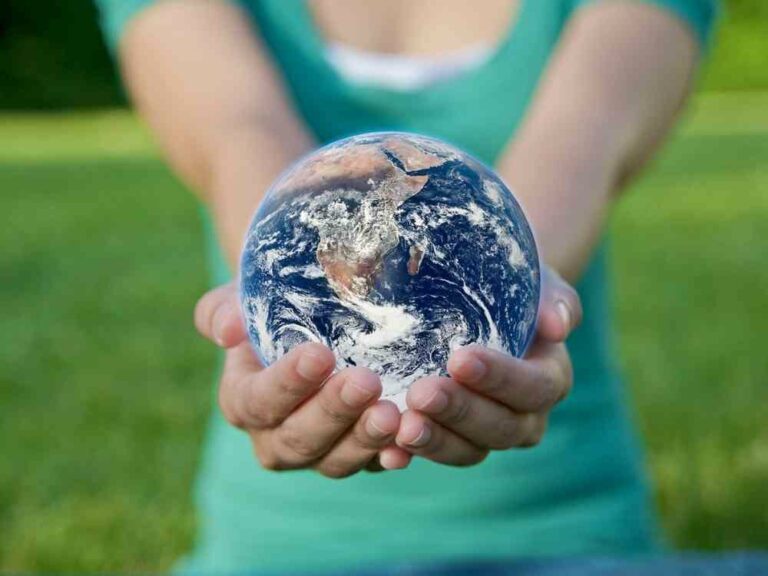 Woman holding earth in her hands