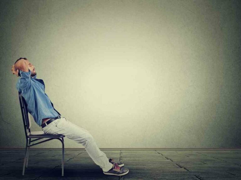 Relaxed man sitting in chair